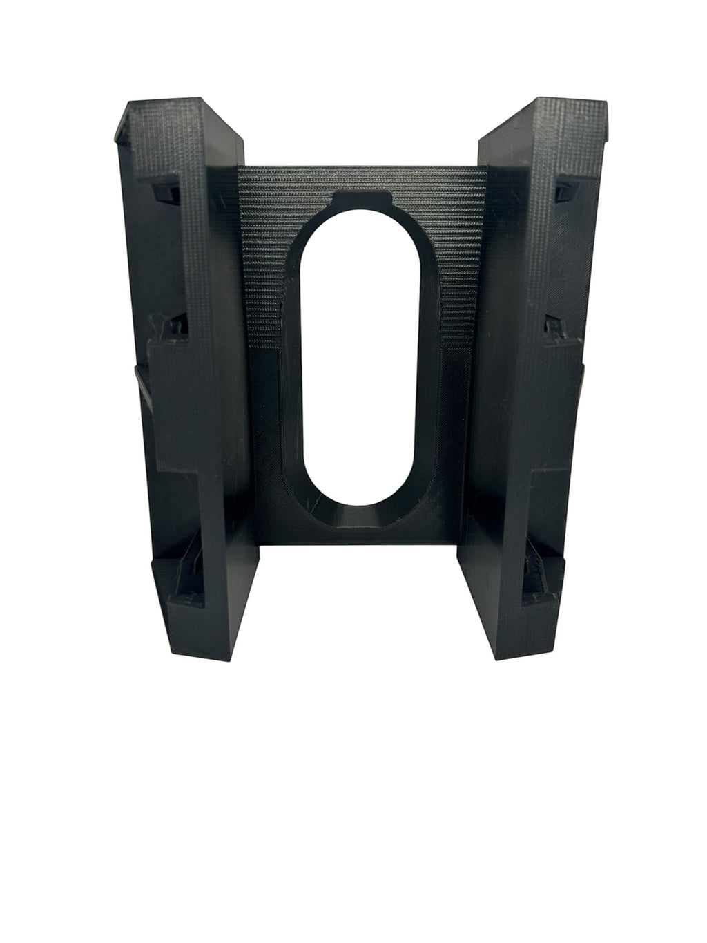 Cold Composites black plastic M18 battery holder attachment with magnetic handle slot.